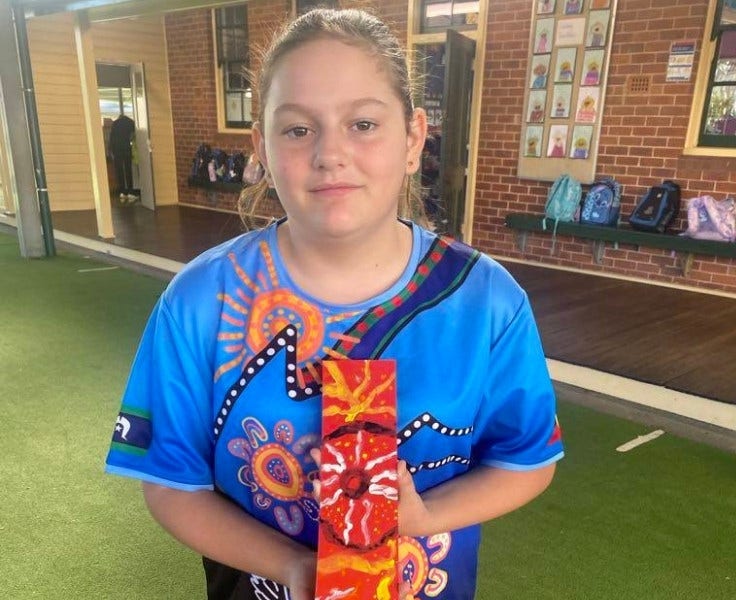 Student showing Indigenous artwork made on NAIDOC Day