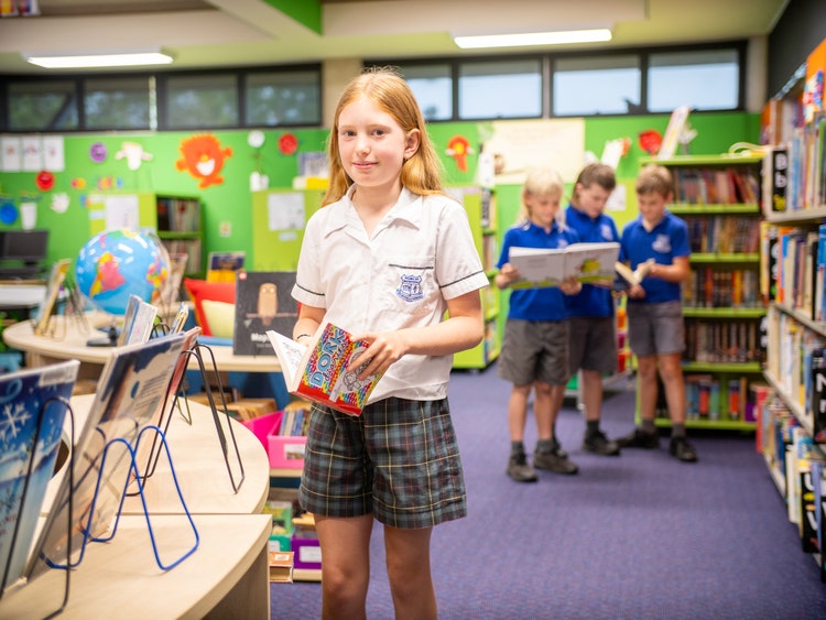 Students in library reading