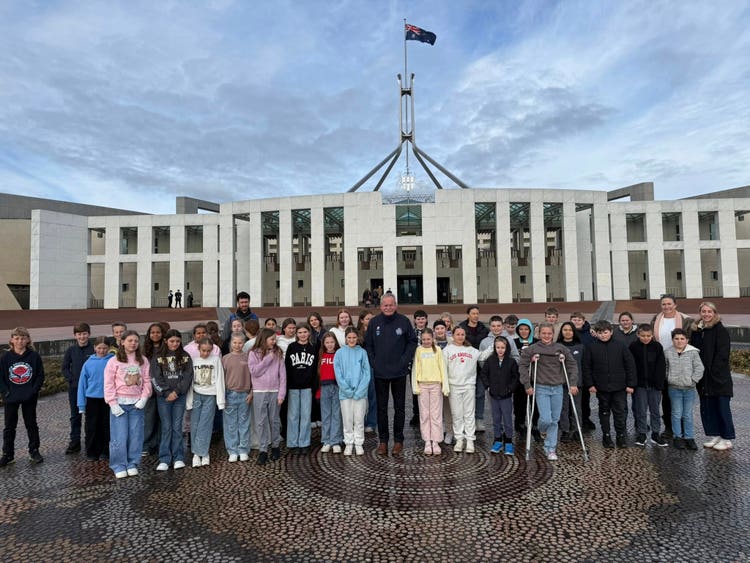 Year 5 and 6 students standing in front of Parliament House