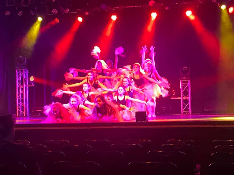 Far North Coast Dance Festival performing on stage with bright lights