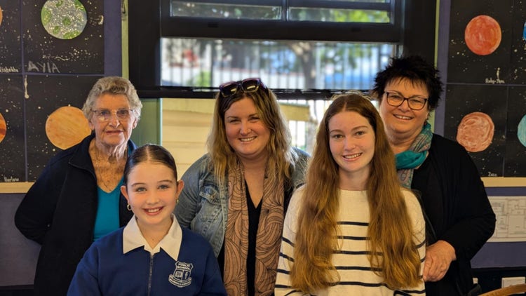 A student with her family during open classrooms