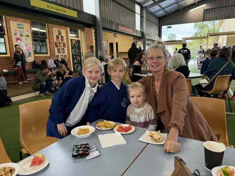 Students with family enjoying the big breakfast event